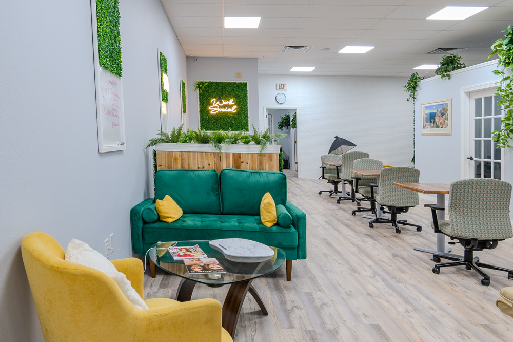 Lounge with green and yellow sofas at Work Social