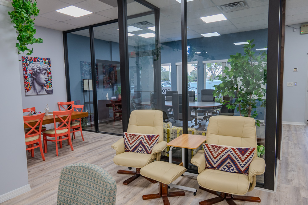Lounge chairs by the glass offices at Work Social